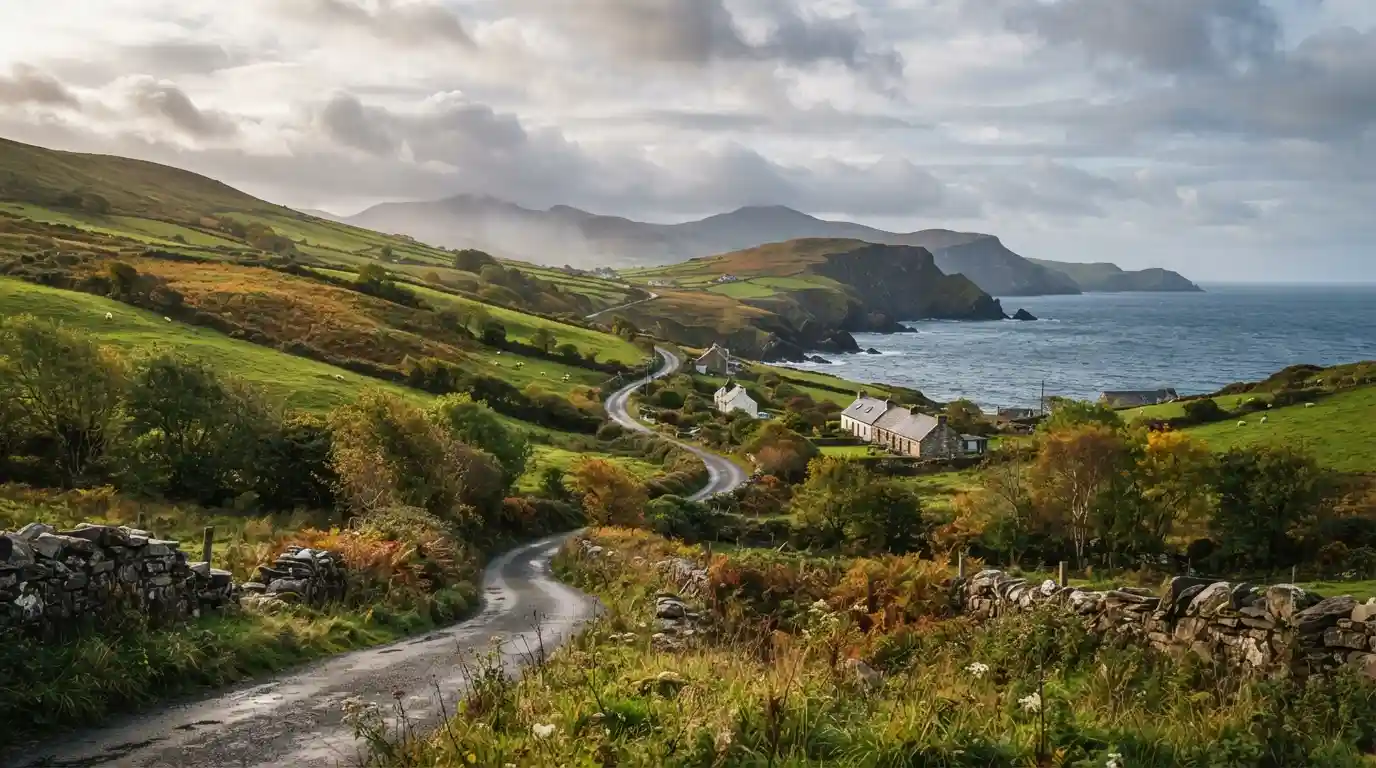 Autumn landscape with golden foliage, green hills, stone walls, and a coastal road in Ireland