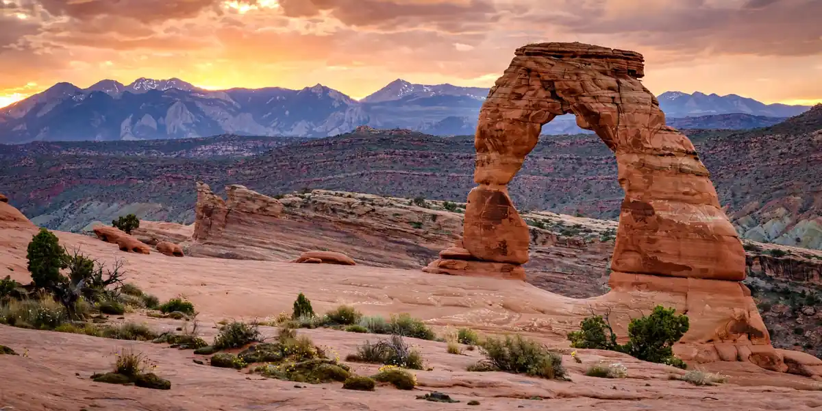 Delicate Arch sandstone arch at sunset in Arches National Park, Utah