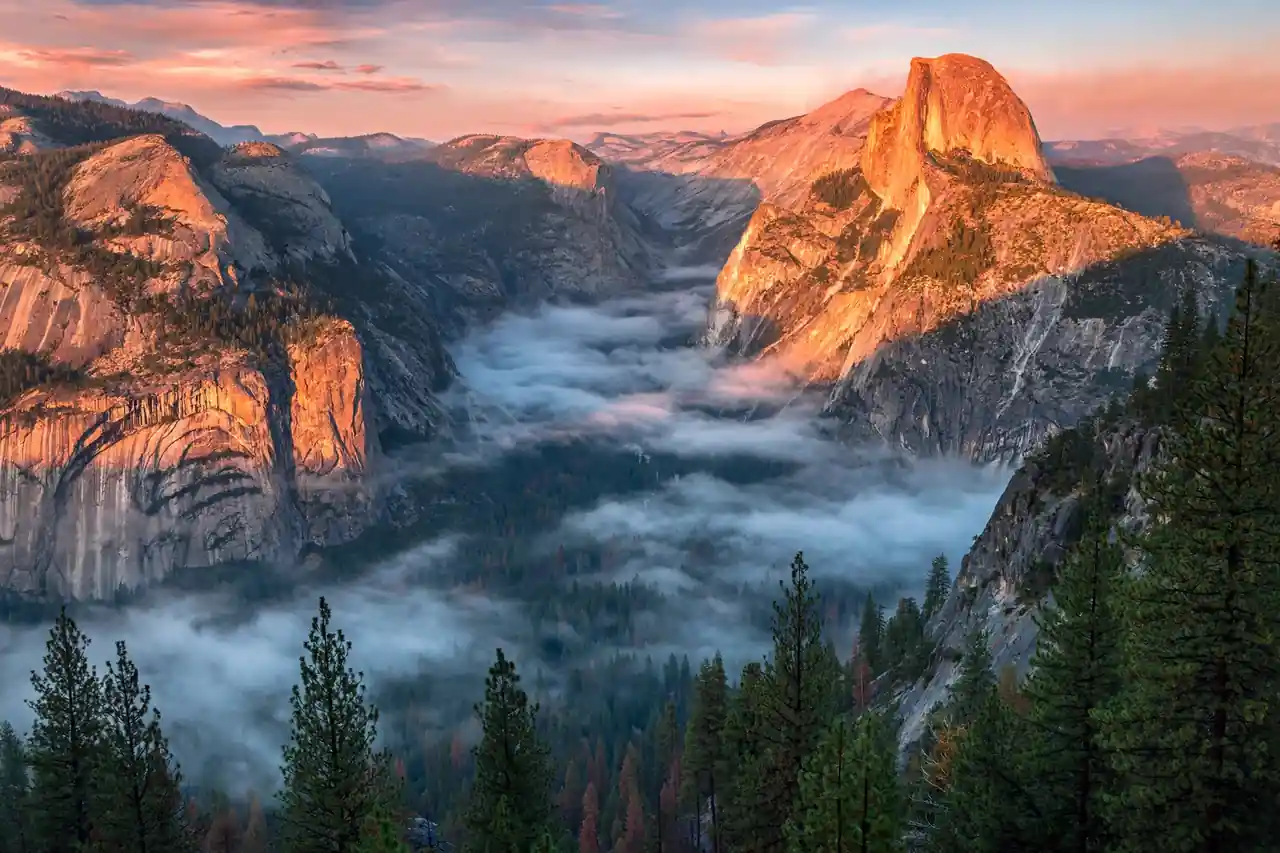 Half Dome towering over Yosemite Valley at sunrise