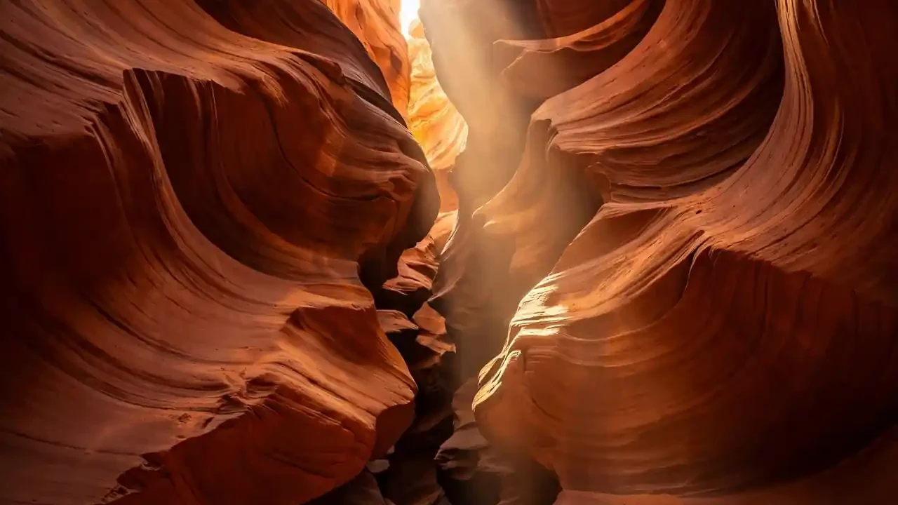 Sunbeam filtering through a narrow Utah slot canyon