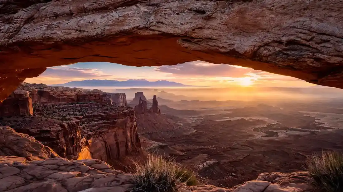 Mesa Arch framing sunrise over Canyonlands National Park canyons