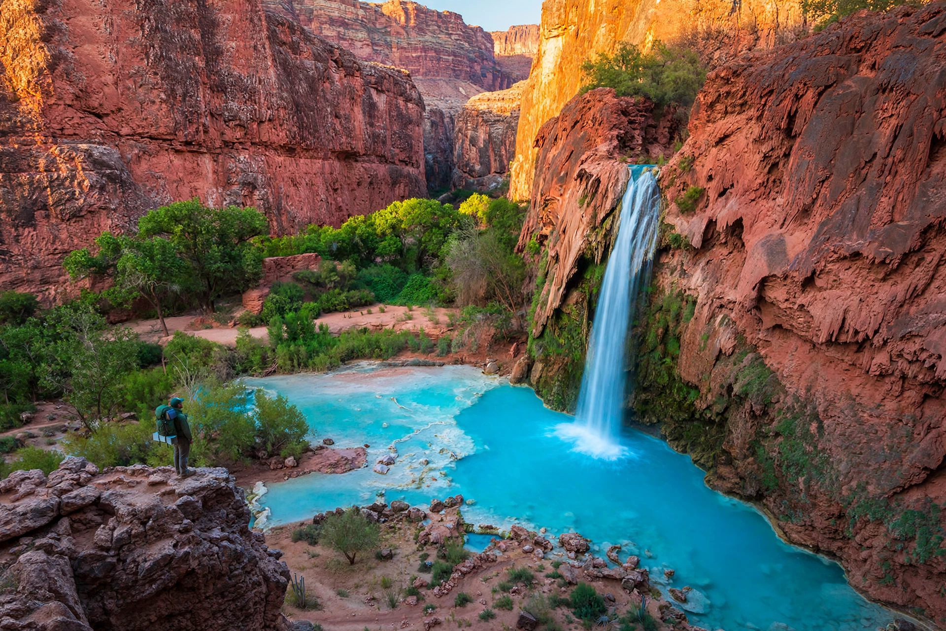 Havasu Falls turquoise waterfall flowing over red canyon cliffs in Arizona